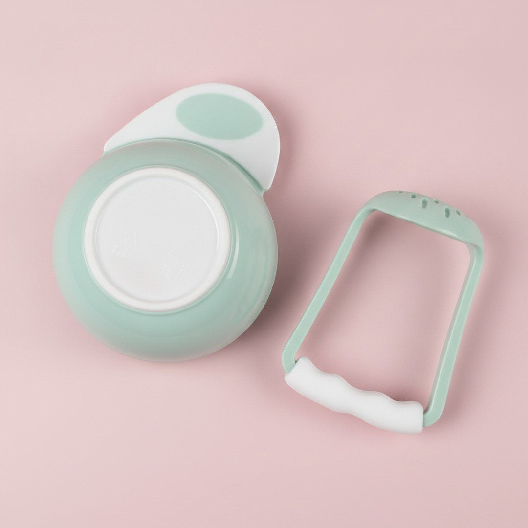 DearXime green manual baby food grinder and bowl set for easy fruit and vegetable puree preparation.