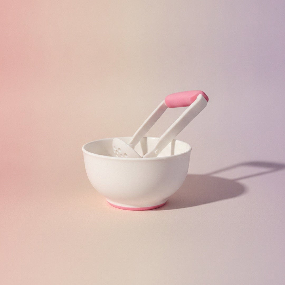 DearXime manual baby food grinder and bowl set in white with pink accents for easy fruit and vegetable pureeing.