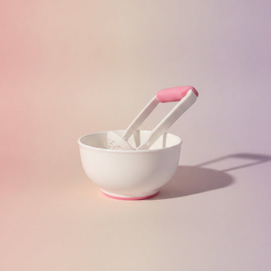 DearXime manual baby food grinder and bowl set in white with pink accents for easy fruit and vegetable pureeing.